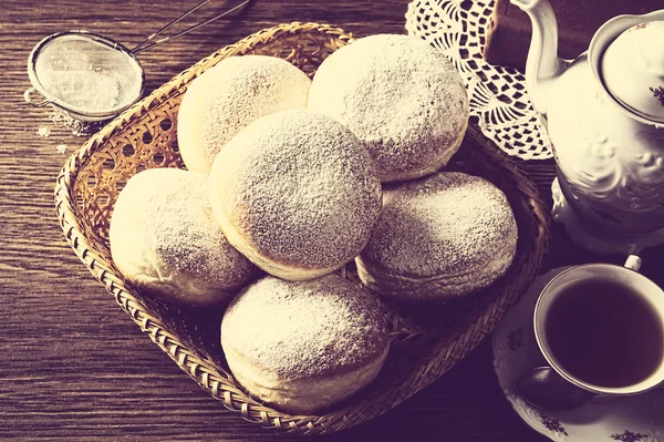 Doughnuts in wicker basket view from above with strainer vintage — Stock Photo, Image