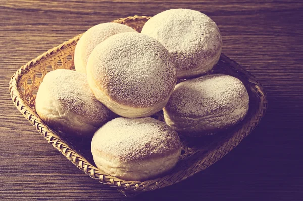 Many of doughnuts in wicker basket view from above vintage — Stock Photo, Image