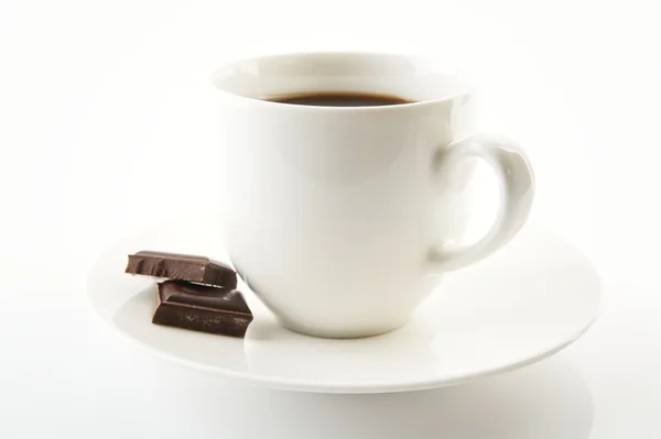 Cup of coffee with chocolate and saucer on white — Stock Photo, Image
