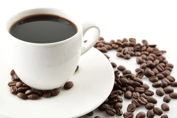 Kopje koffie met schotel bij het ontbijt — Stockfoto