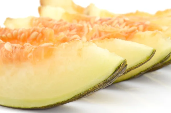 Macro shot of slice Canary melon on white — 图库照片