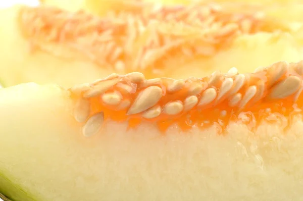 Macro shot of slice Canary melon on white — 图库照片