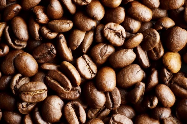 Closeup shot of coffee roasted beans background — Stock Photo, Image