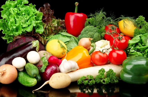 Group of different vegetables on black background — Stock Photo, Image