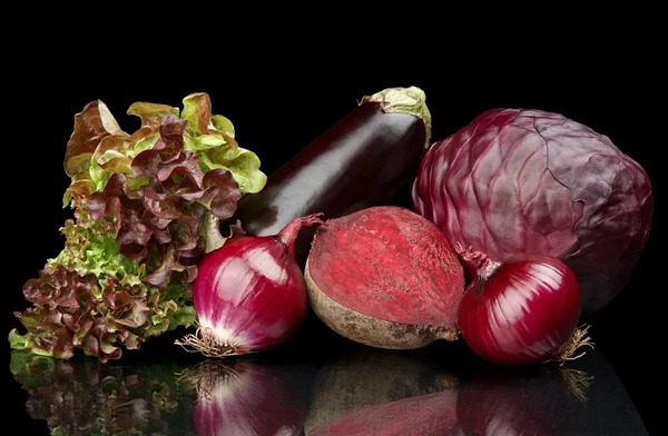 Group of purple vegetables on black — Stock Photo, Image