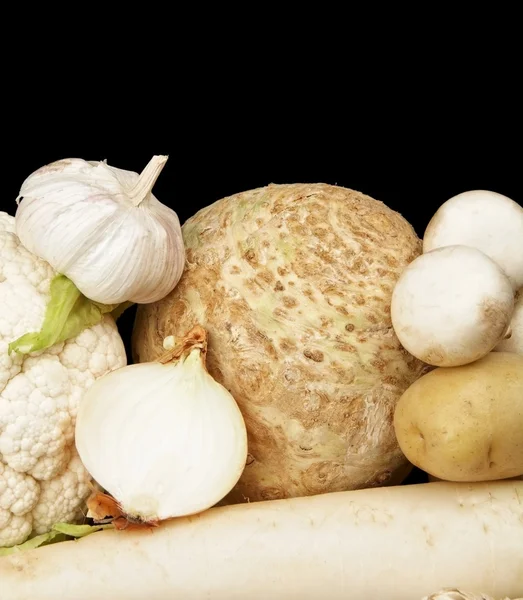 Collection of white vegetables on black bottom view — Stock Photo, Image
