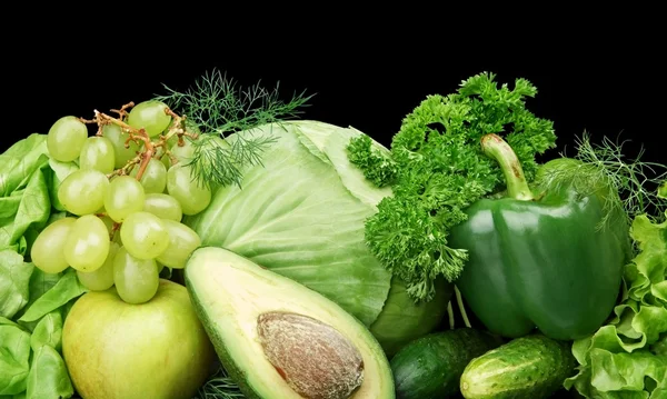 Group of green vegetables and fruits at the bottom horizontal view on black — Stock Photo, Image