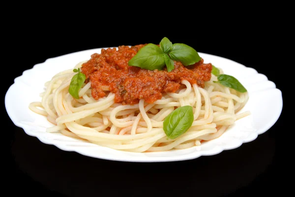 Spaghetti ragu bolognese sauce on black,close up — Stock Photo, Image