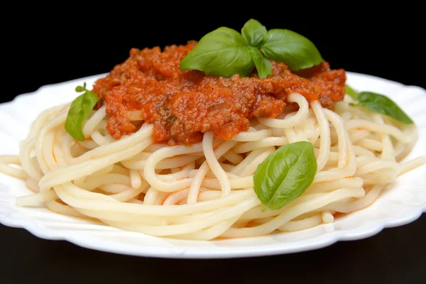 Cropped spaghetti ragu alla bolognese sauce on black — Stock Photo, Image