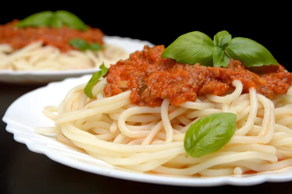 Close up pasta ragu alla bolognese sauce on black — Stock Photo, Image