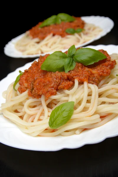 Close up pasta ragu alla bolognese sauce on black — Stock Photo, Image