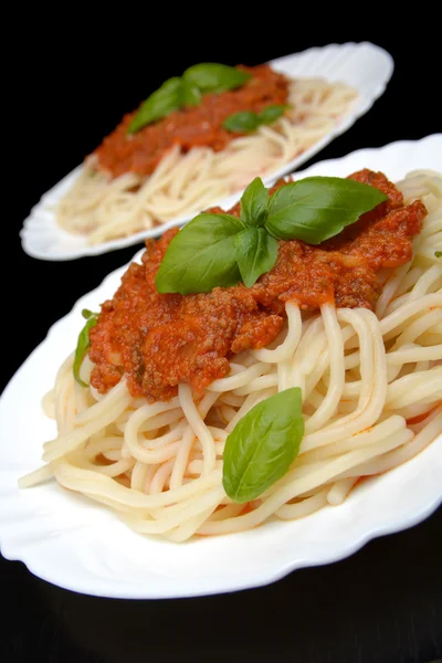 Spaghetti ragu alla bolognese sauce on black,close up — Stock Photo, Image