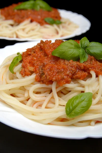 Pasta with ragu a'la bolognese on black background — Stock Photo, Image