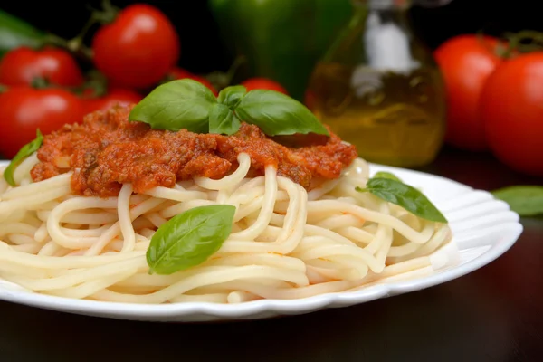 Spaghetti bolognese on black — Stock Photo, Image