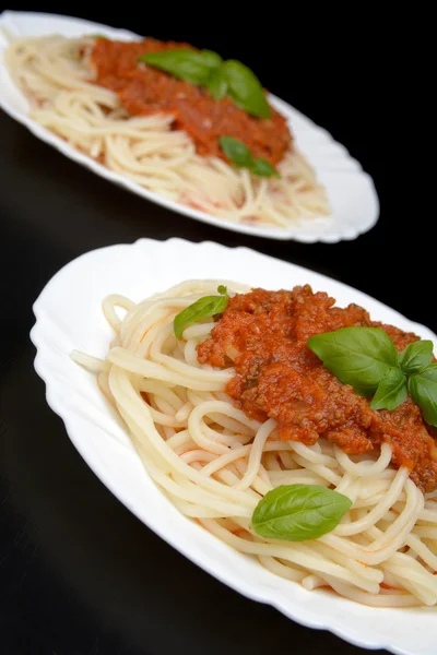Close up pasta ragu alla bolognese sauce on black — Stock Photo, Image