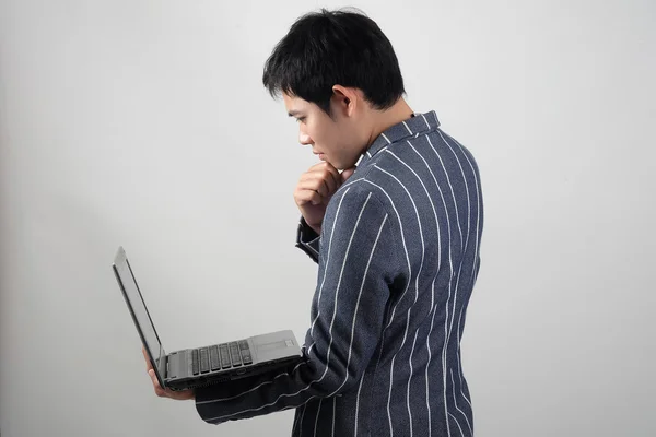 Asian businessman with laptop — Stock Photo, Image