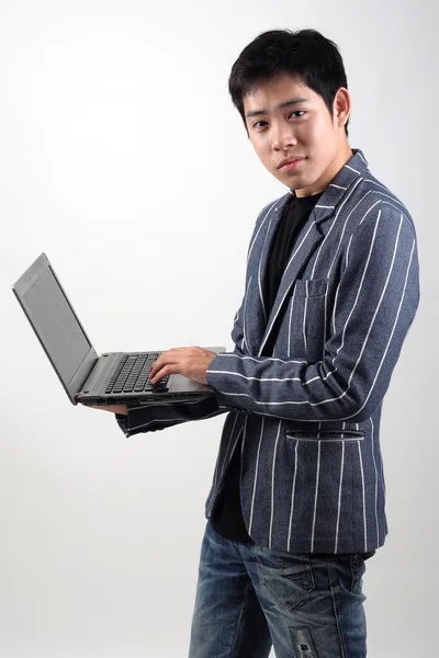 Asian businessman with laptop — Stock Photo, Image