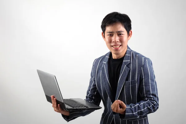 Asian businessman with laptop — Stock Photo, Image