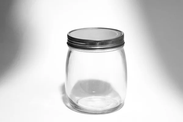 Empty glass canister in white background — Stock Photo, Image