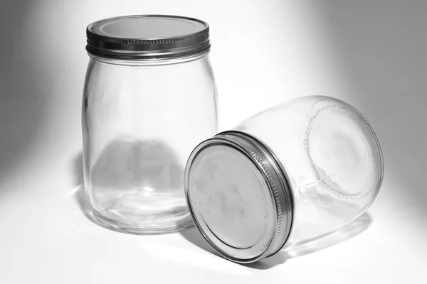 Empty glass canister in white background — Stock Photo, Image