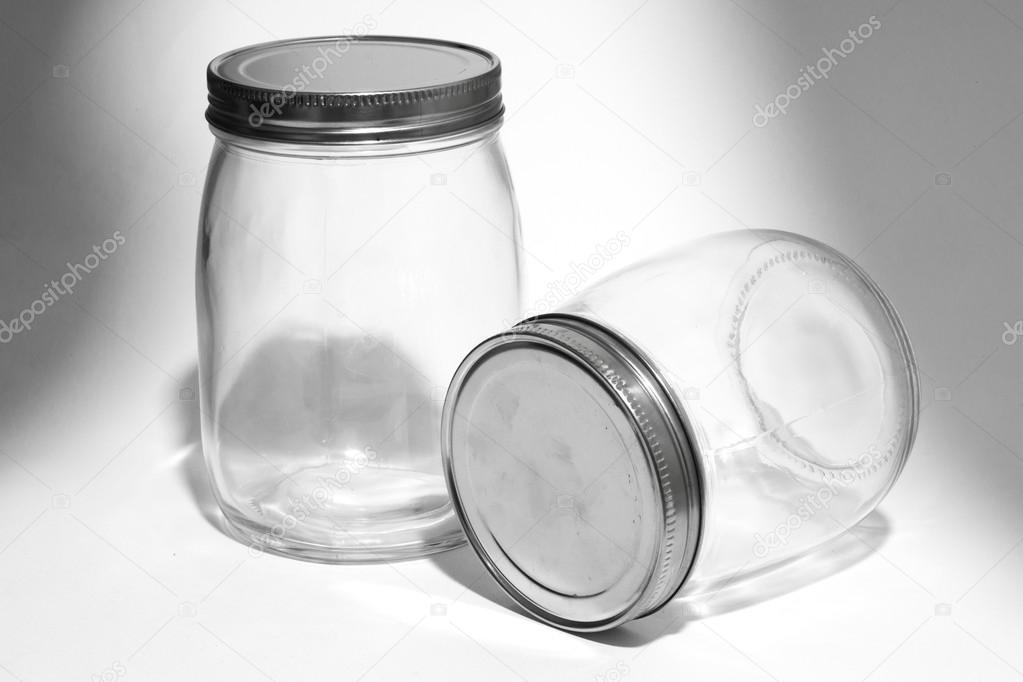 Empty glass canister in white background