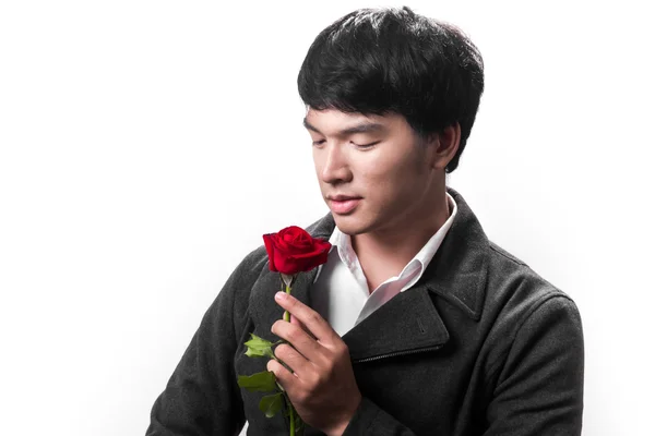 Asian handsome man hold the red rose with love in white background — Stock Photo, Image