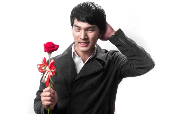 Asian handsome man hold the red rose with love in white background — Stock Photo, Image