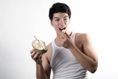 Asian man eating Durian clipart