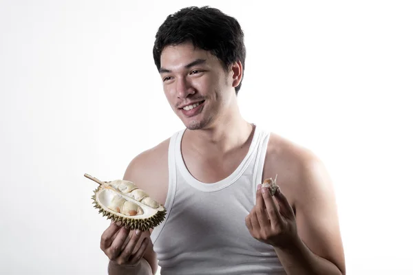 Asian man eating Durian — Stock Photo, Image