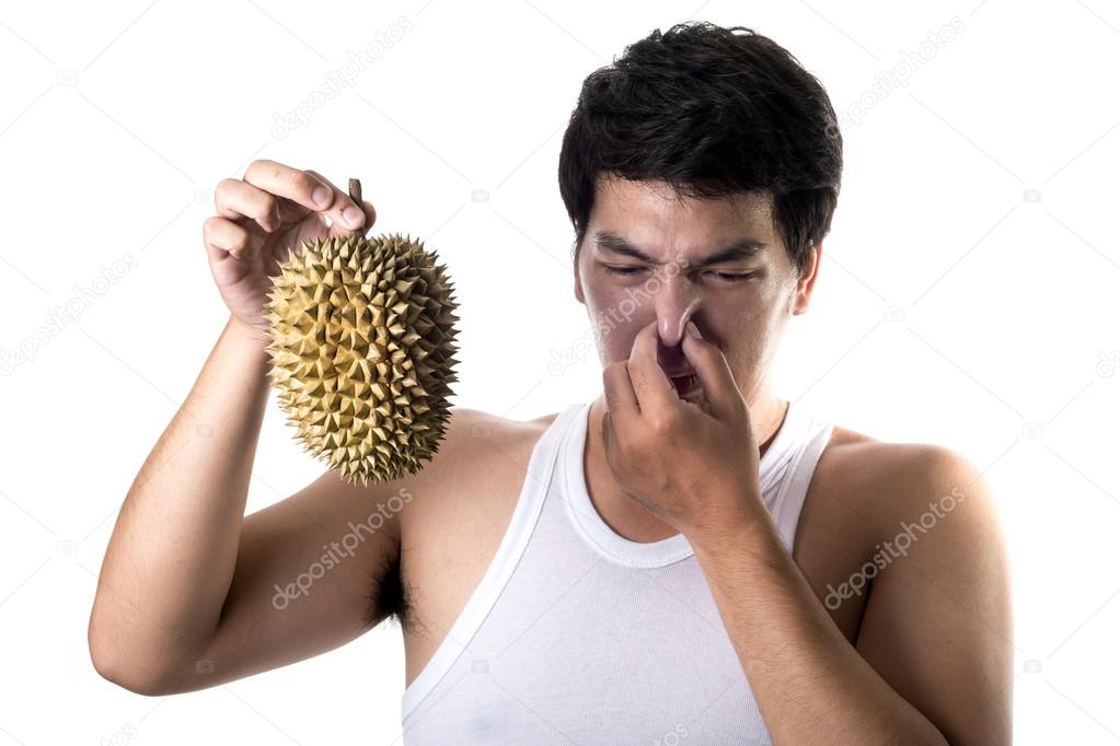 Asian man with bad smell of durian in white background