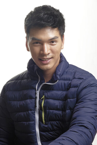 Portrait of Asian man in the down coat