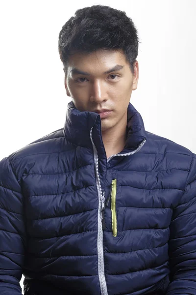 Portrait of Asian man in the down coat — Stock Photo, Image