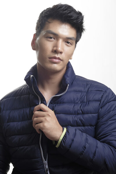 Portrait of Asian man in the down coat