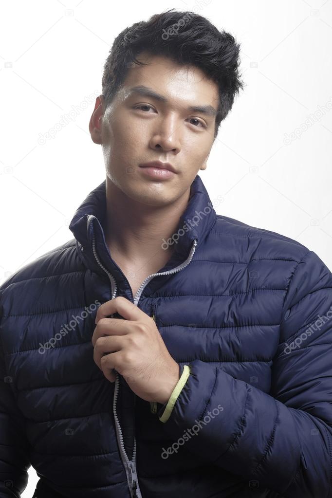 Portrait of Asian man in the down coat