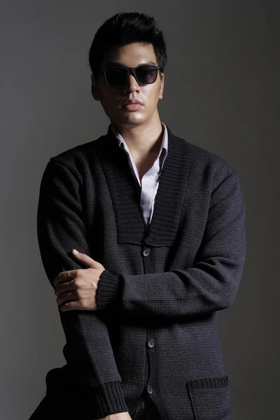 Asian man in yarn cardigan with sunglasses — Stock Photo, Image