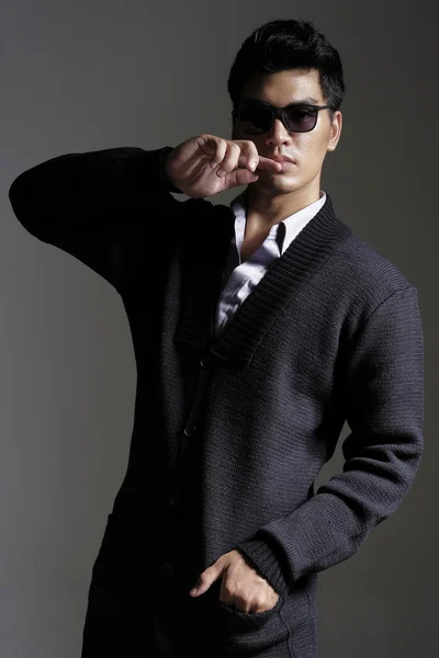 Asian man in yarn cardigan with sunglasses — Stock Photo, Image