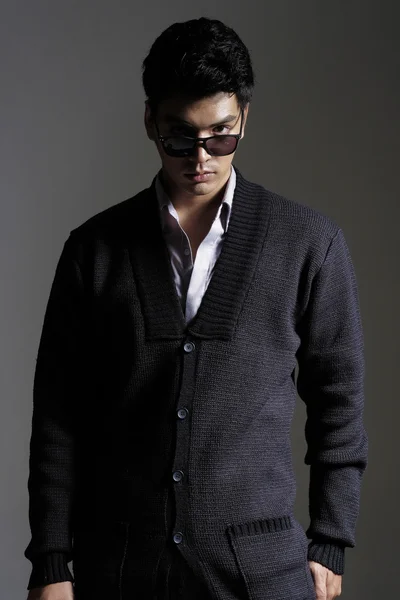 Asian man in yarn cardigan with sunglasses — Stock Photo, Image