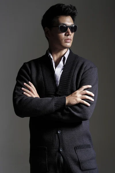 Asian man in yarn cardigan with sunglasses — Stock Photo, Image