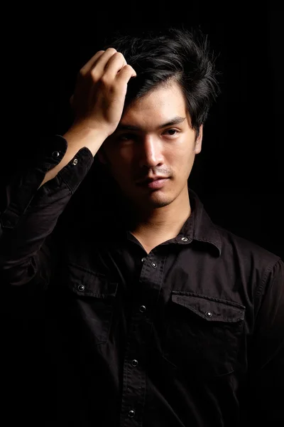 Asian man portrait in the dark — Stock Photo, Image