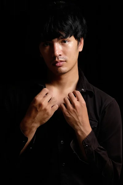 Asian man portrait in the dark — Stock Photo, Image