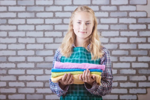 Bright picture of lovely housewife with towels — Stock Photo, Image