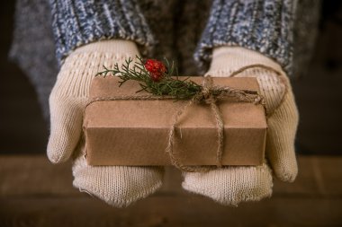woman with a Christmas gift in hand