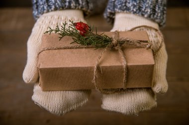 woman with a Christmas gift in hand