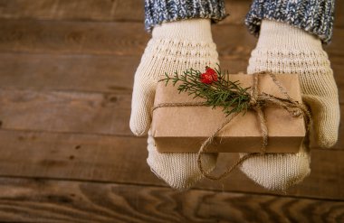 woman with a Christmas gift in hand