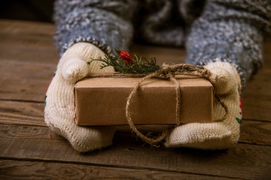 woman with a Christmas gift in hand