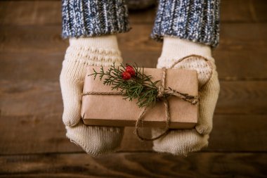 woman with a Christmas gift in hand