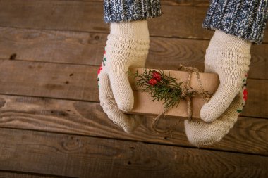 woman with a Christmas gift in hand
