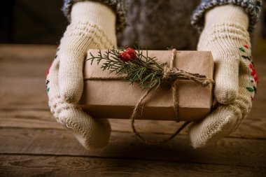 woman with a Christmas gift in hand