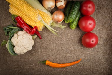 vegetables: onions, peppers, cabbage, tomatoes, corn