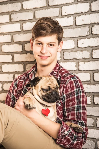 Young man with a dog — Stock Photo, Image